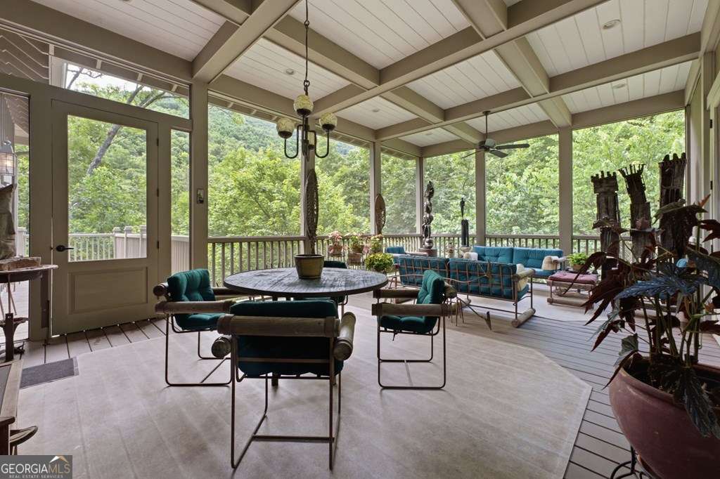 Screened porch with forest and mountain outlook