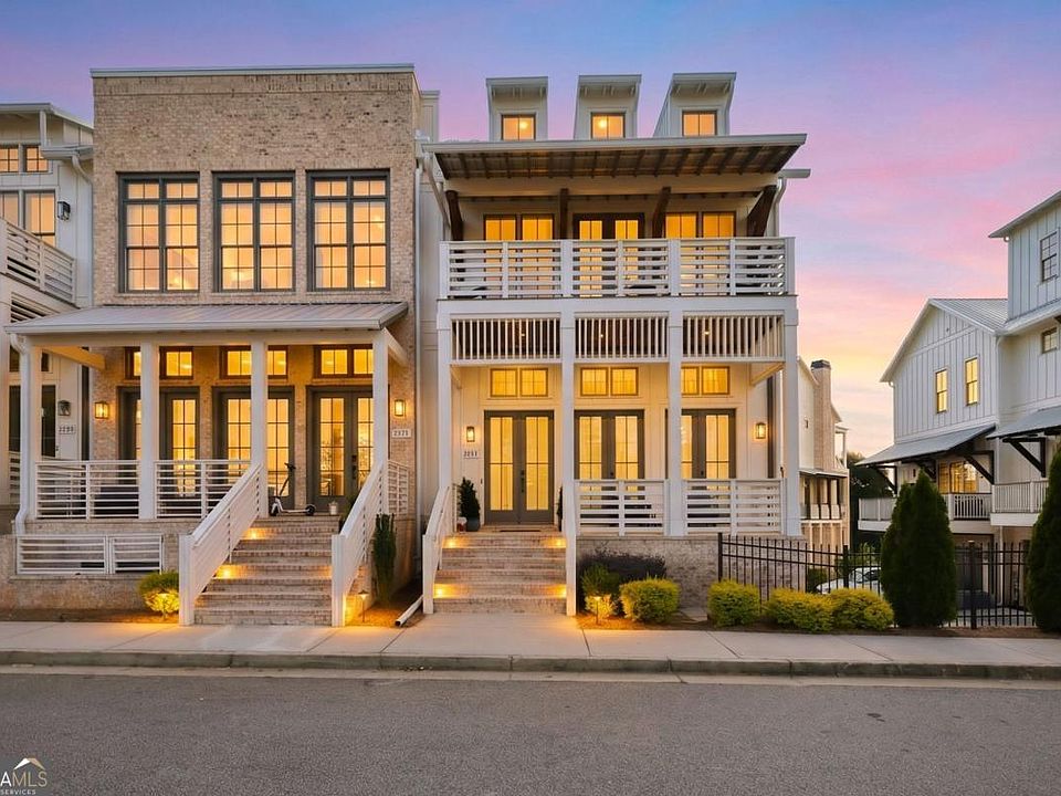 A sample home exterior presented at dusk
